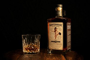dark glass whiskey bottle with lid