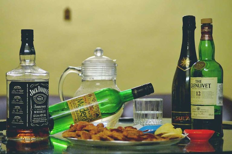 different colors of liquor bottles
