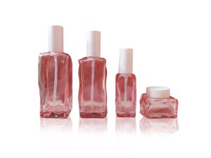 cosmetic packaging pink glass lotion bottle and cream jars wholesale set