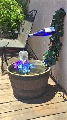 blue glass whiskey bottle in the garden