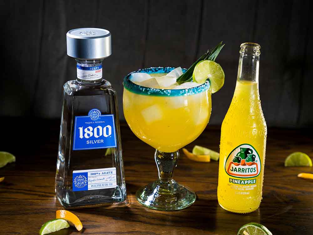 white and blue tequila bottle