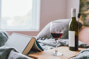 glass wine bottle next to a glass wholesale