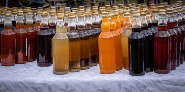 special size of glass juice bottles with lids wholesale